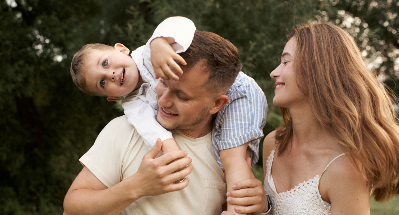 parents with their toddler looking happy